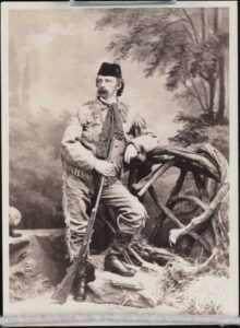 an 1873 picture of George Custer posing with a rifle