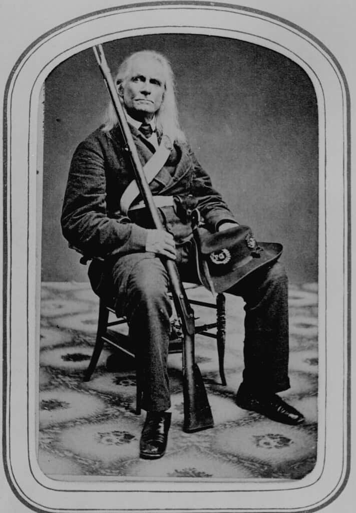 Private Edmund Ruffin showing off one of his confederate firearms