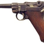 Luger Pistol: Historical Evolution Detailed image of a vintage semi-automatic pistol with a textured wooden grip, showcasing classic firearm design and craftsmanship for firearm enthusiasts.