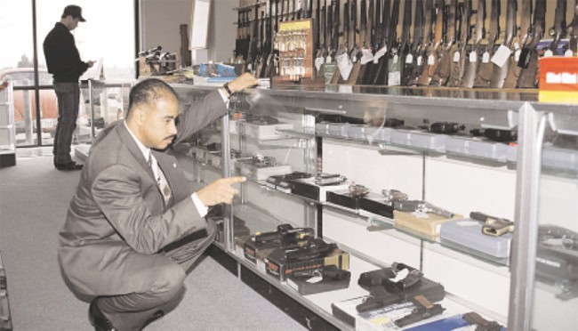 ATF inspector examining firearms at a federally-licensed gun dealer