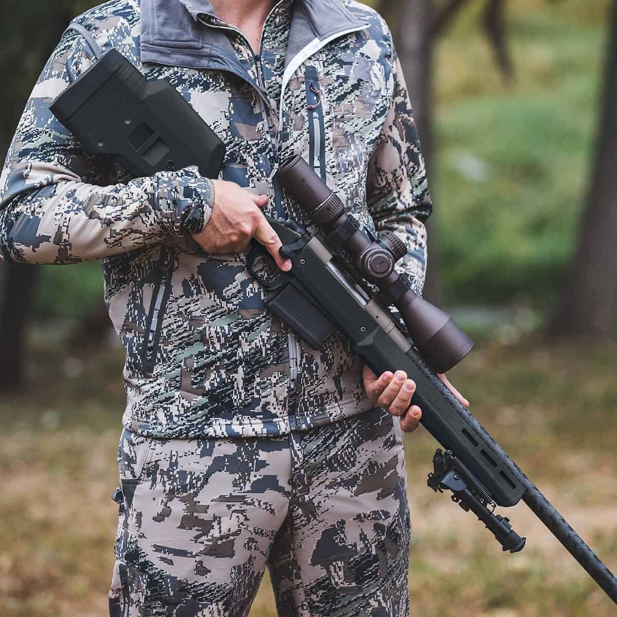 Hunter carrying Remington 700 in Magpul Hunter stock in the field