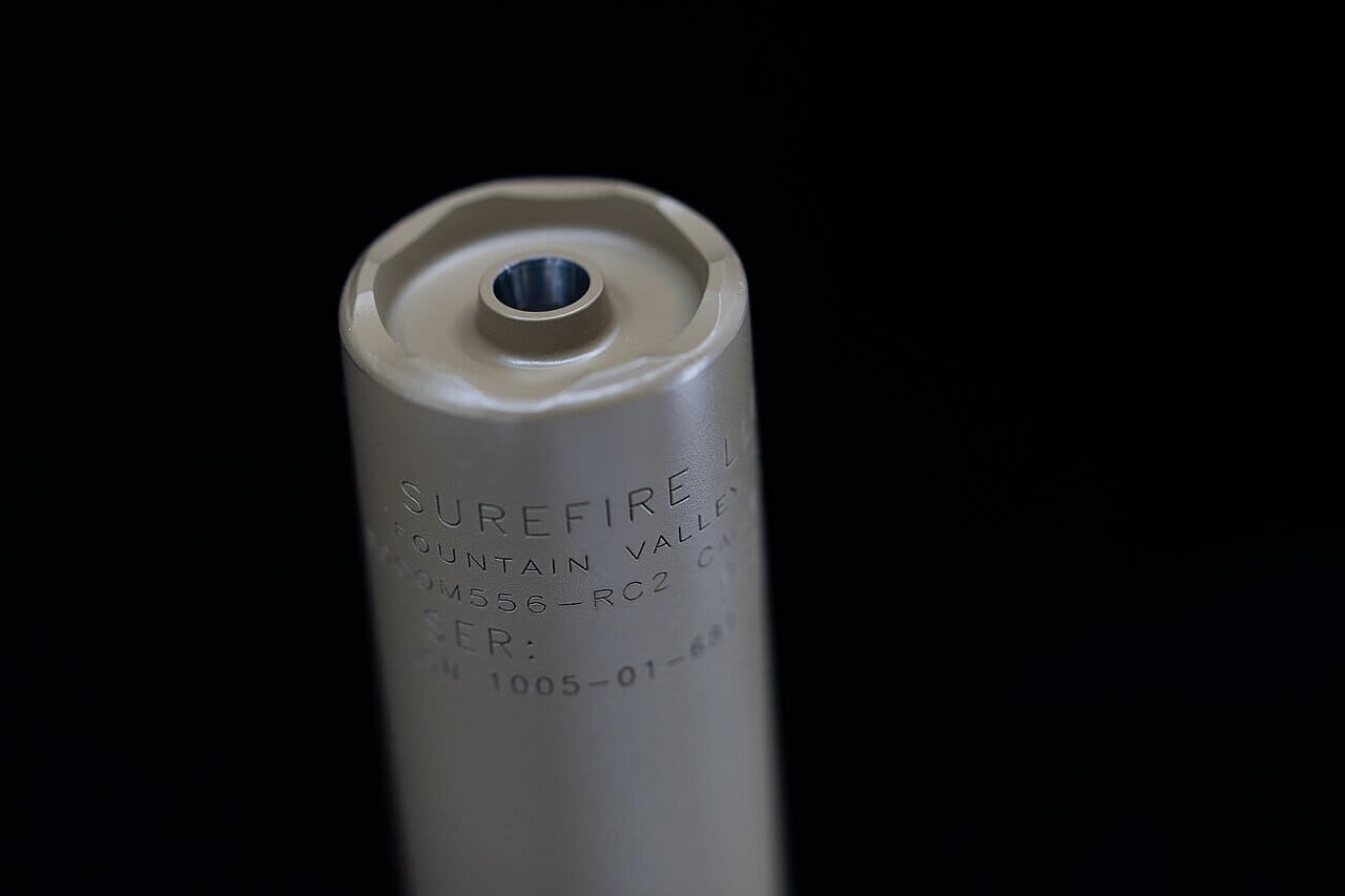 Suppressor mounting systems — a SureFire SOCOM556-RC2 fast-attach suppressor shown mounted on an AR-15